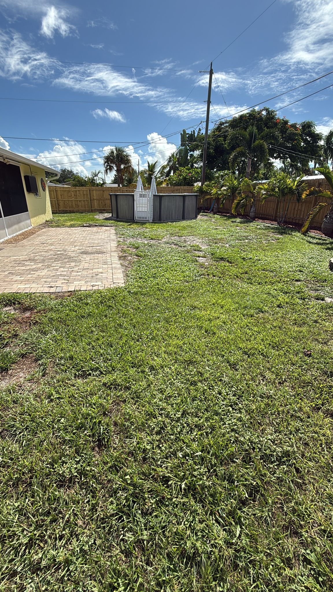 Fake Grass for backyard and pool area Jupiter Florida Before